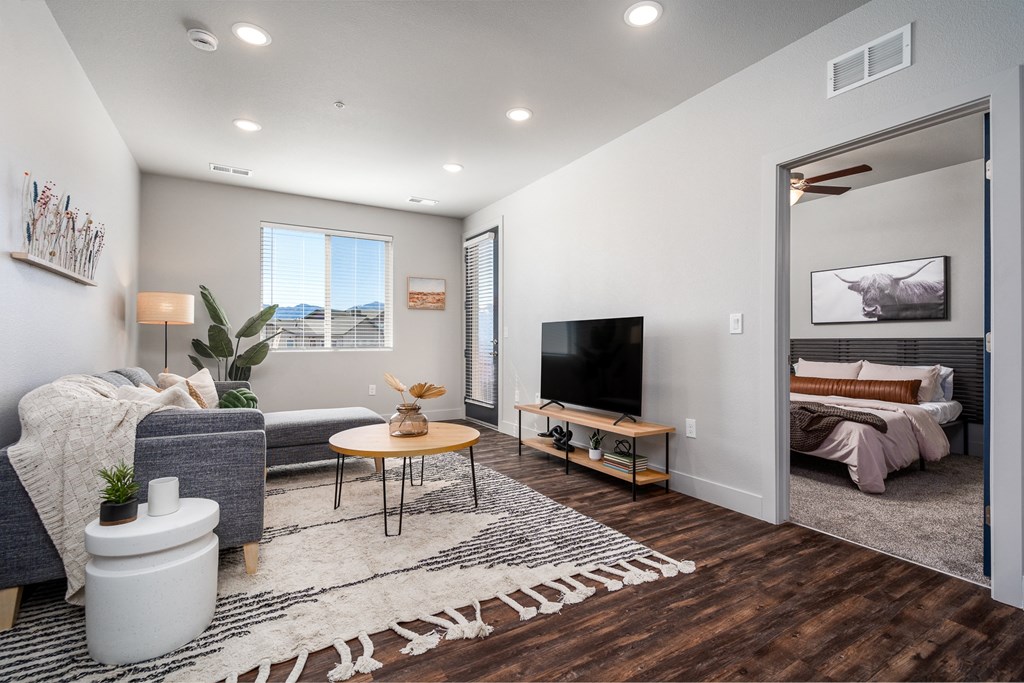 an open living room with a couch and a tv