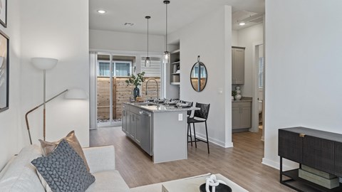 a living room with a kitchen and a dining room