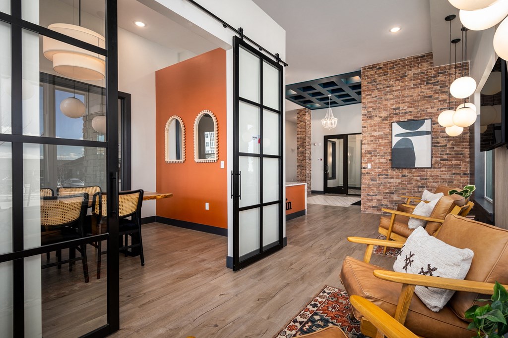 the living room and dining room are separated by a sliding glass door