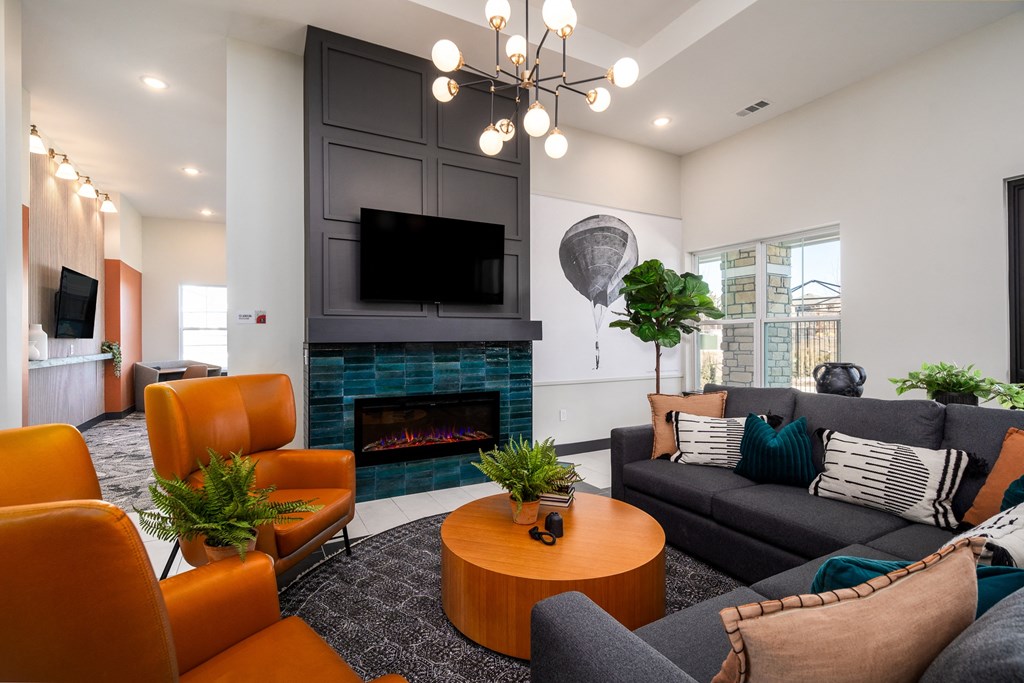 the preserve at ballantyne commons living room with couches and a fireplace