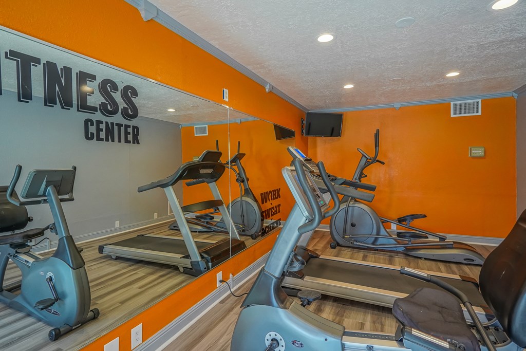 the gym at the tides center is equipped with treadmills and exercise equipment
