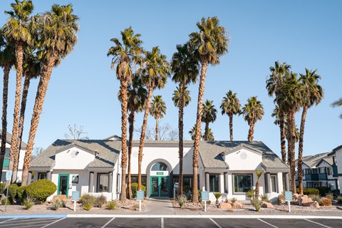 a building with palm trees in front of it
