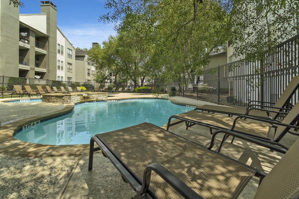 our apartments have a resort style pool and lounge chairs