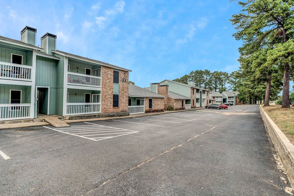 a parking lot at the whispering winds apartments in pearland, tx