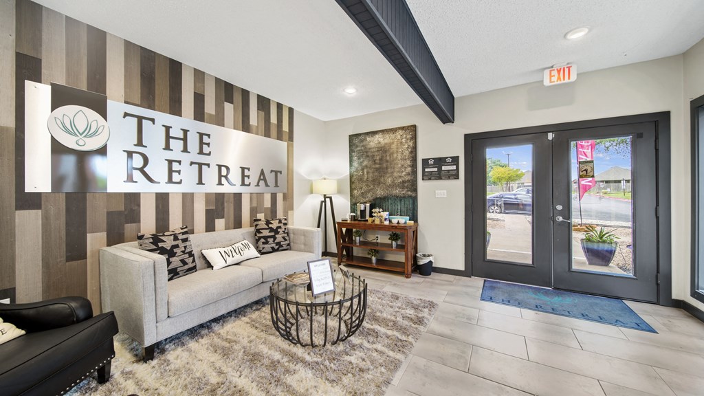 the retreat apartments l living room with couch and coffee table