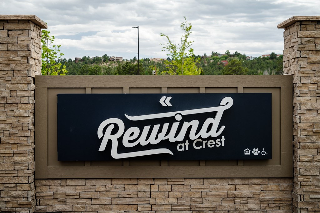 a sign for reunion ofsted on a brick wall