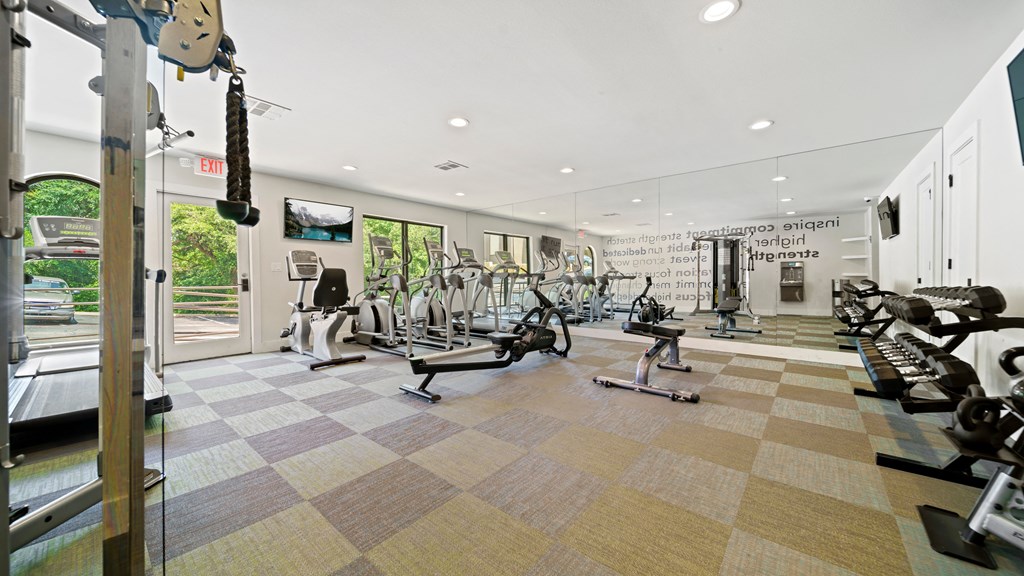 the gym at the enclave at woodbridge apartments in sugar land, tx
