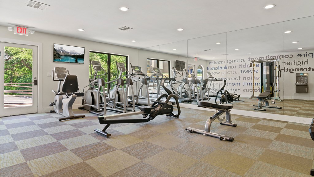 the gym at the enclave at woodbridge apartments in sugar land, tx