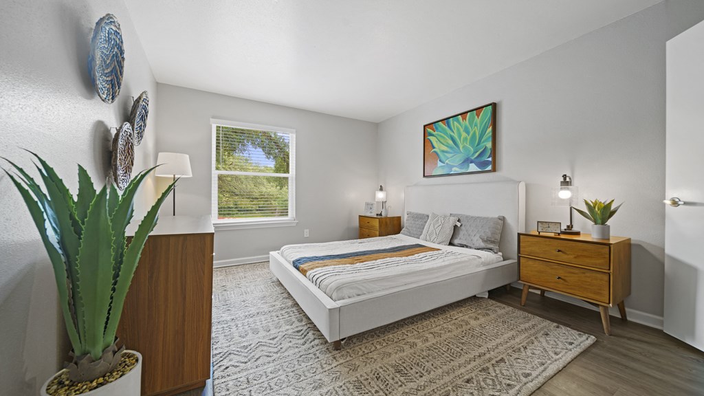 a bedroom with a bed and a dresser