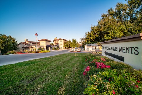 a building with a sign on the side of a road