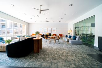 a large room with couches chairs and tables