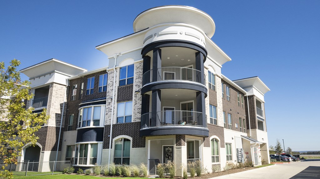 a large apartment building with a large tower on top of it