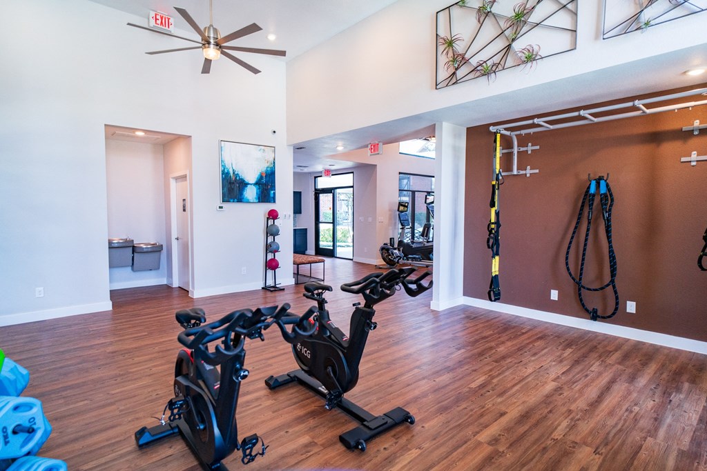 the gym at the district at highland village apartments
