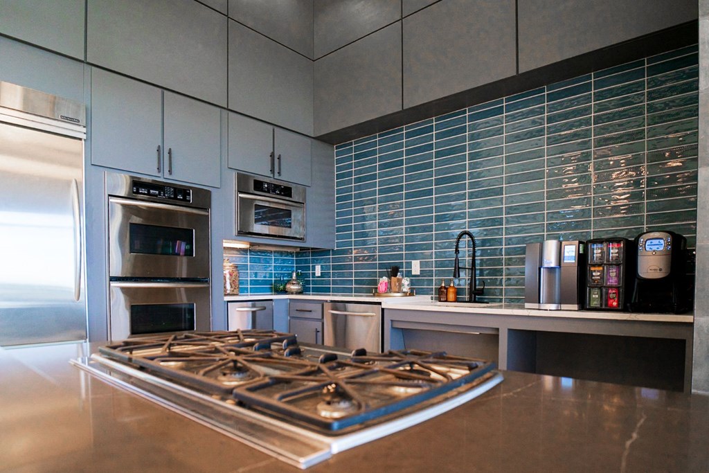 a kitchen with a stove and a counter top