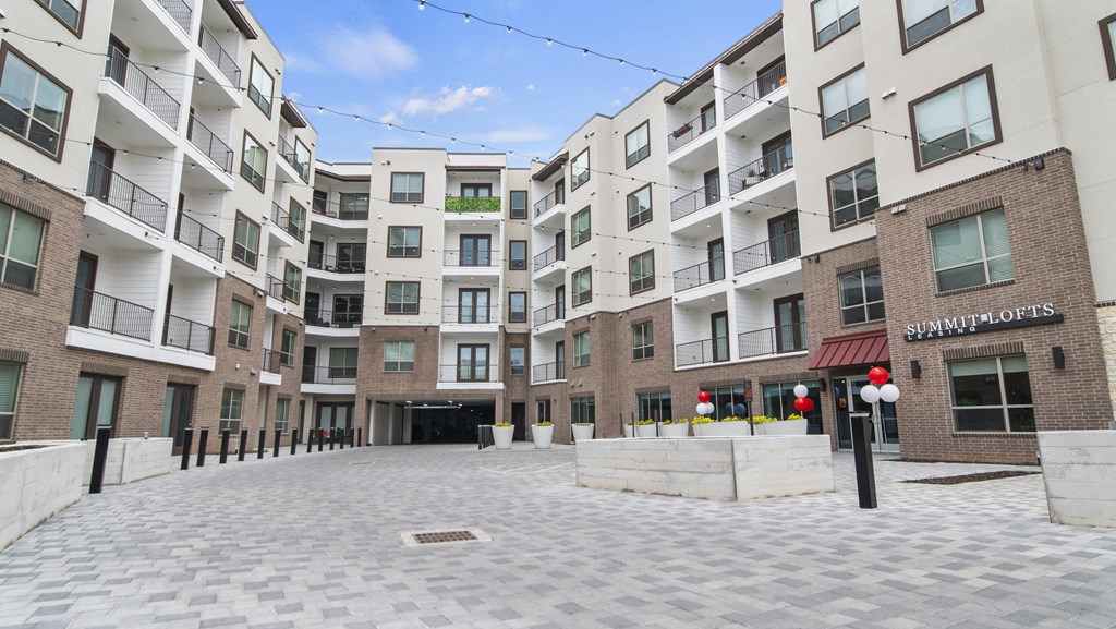 a courtyard in front of a building