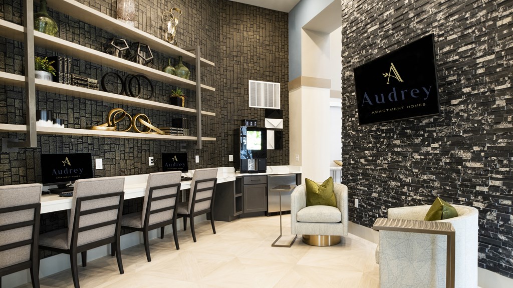 a dining room with a table and chairs and a wall with a sign on it