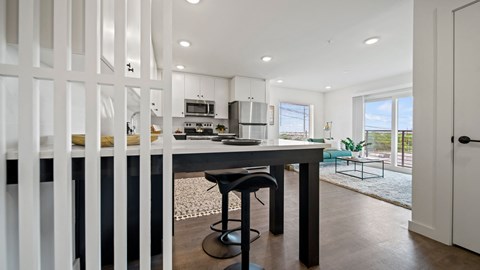 a kitchen with an island and stools
