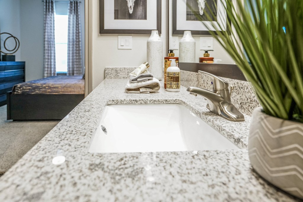 an image of a bathroom with a sink and a counter top
