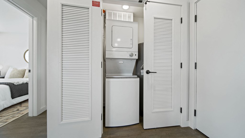 a small laundry room with a washer and dryer
