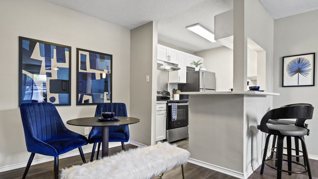 a kitchen and dining area in a 555 waverly unit