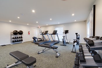 Fitness center with treadmills, free weights, and exercise balls. - Photo Gallery 17