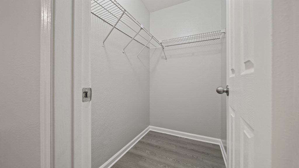 a walk in closet in a 555 waverly unit