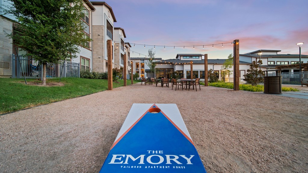 a sign that reads the emory is on the ground in front of a building