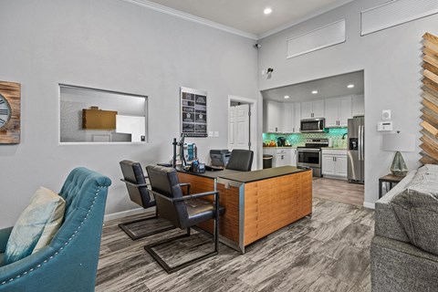 A modern kitchen with a dining table and chairs.