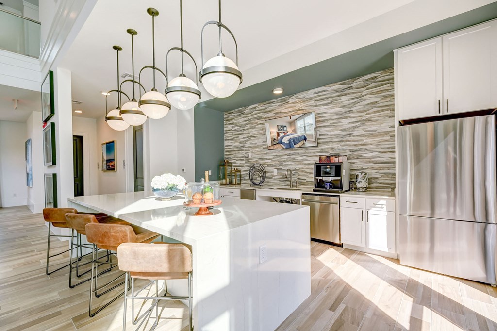 Clubhouse kitchen with island and barstools