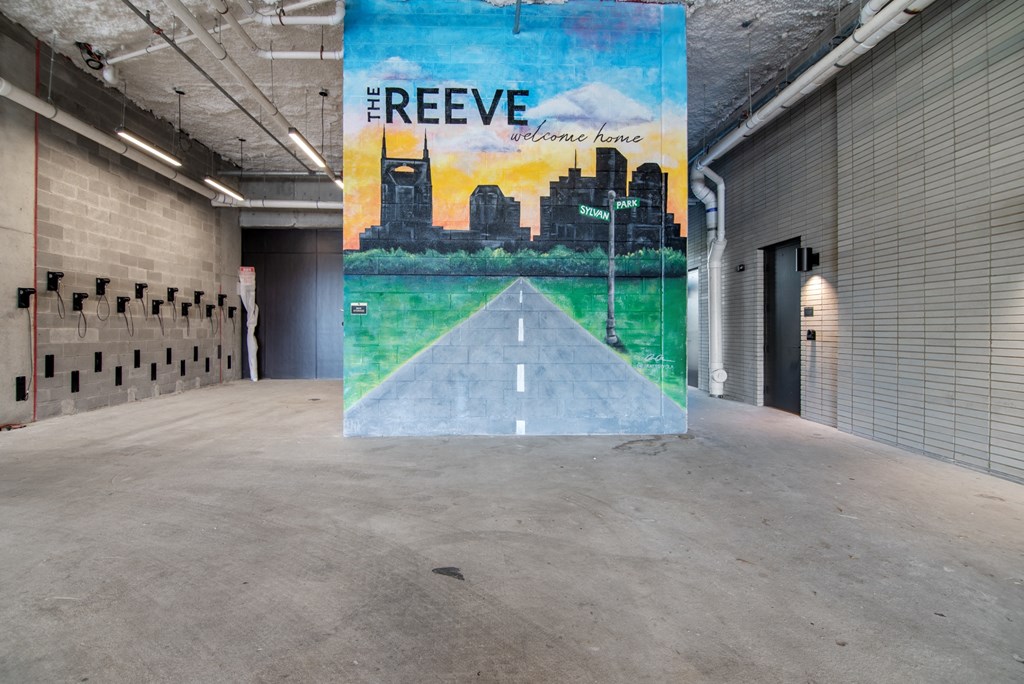 a mural in a building with a road in the middle