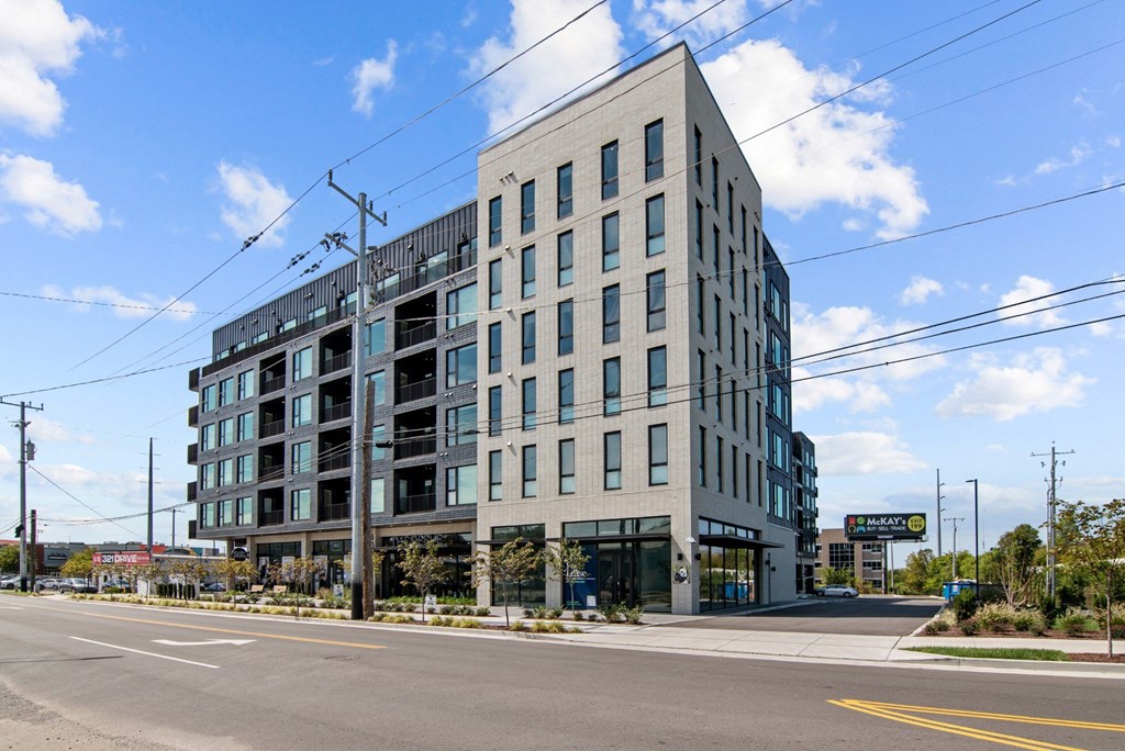 a tall building with a street in front of it