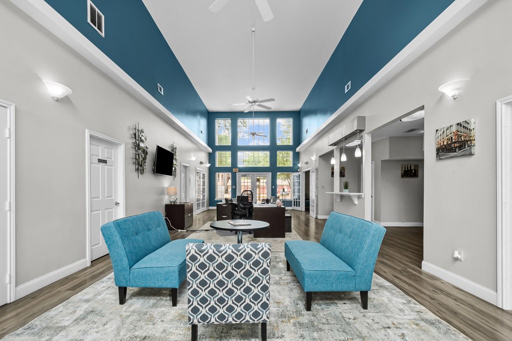 A living room with a blue and white color scheme.
