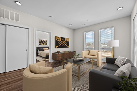 A modern living room with a glass coffee table and a large window.