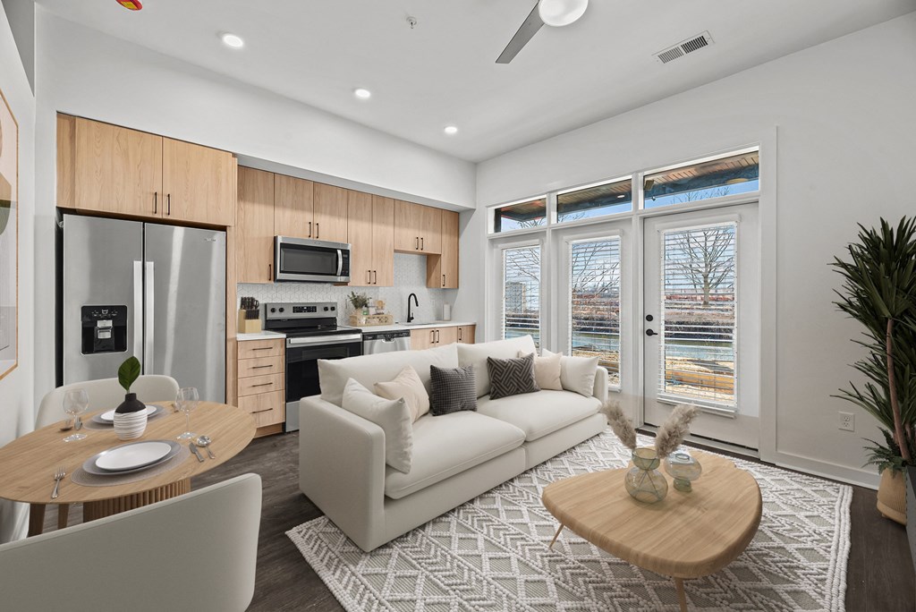 A modern living room with a dining table and a couch.