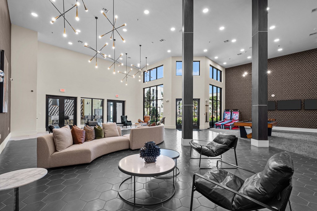 a large lobby with couches and chairs and a table