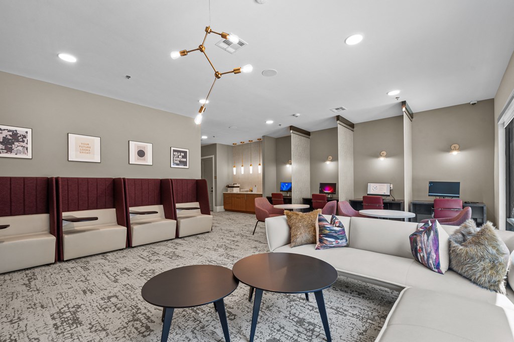 a living room with couches and chairs and tables