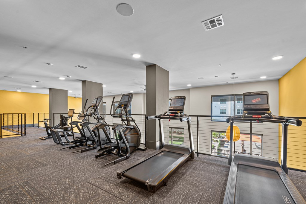 the gym has cardio equipment and treadmills at the flats at west end apartments