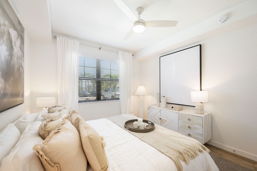 a bedroom with a bed and a dresser