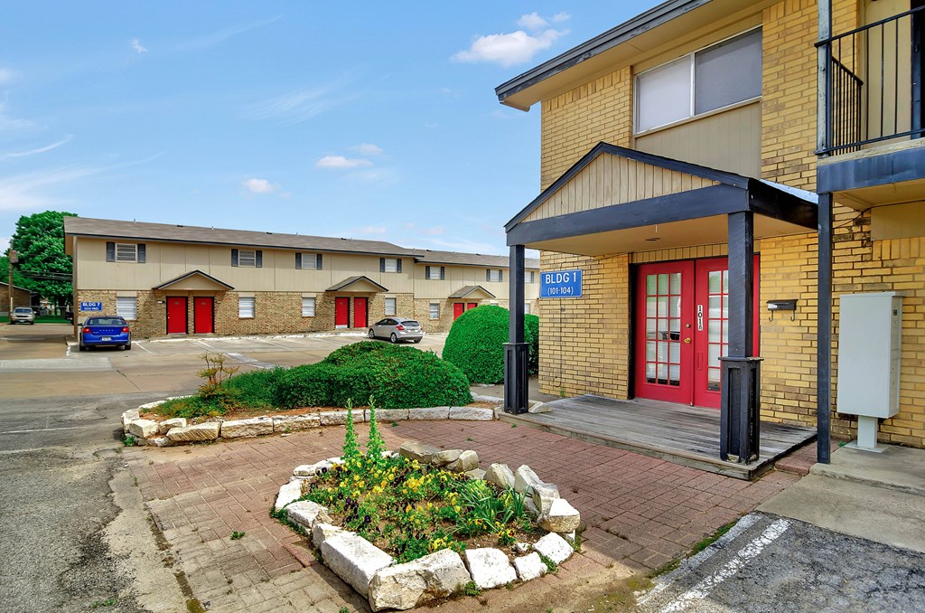 A building with a red door and a sign that says "B10" is shown.