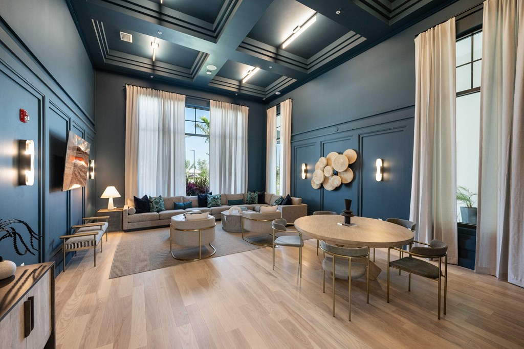 a living room filled with furniture and a large window