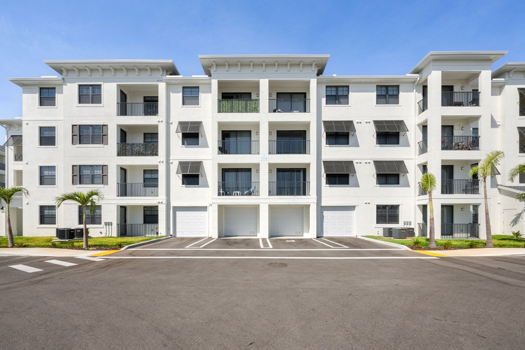 a large parking lot in front of an apartment building