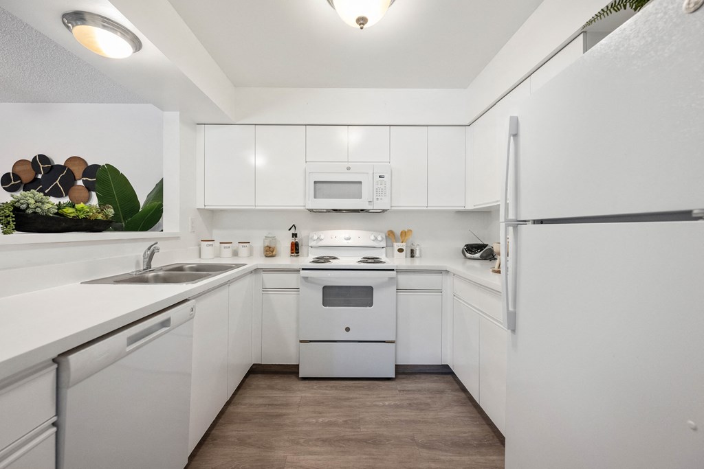 the preserve at ballantyne commons apartment kitchen with white appliances