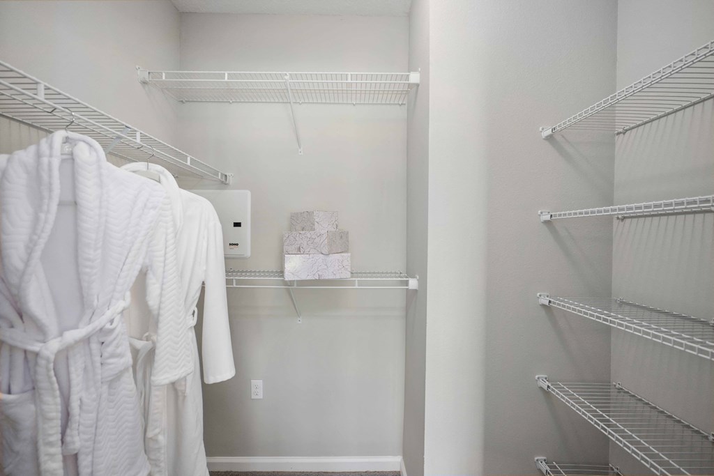a walk in closet in a 555 waverly unit