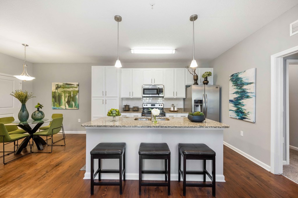 a kitchen and dining area in a 555 waverly unit