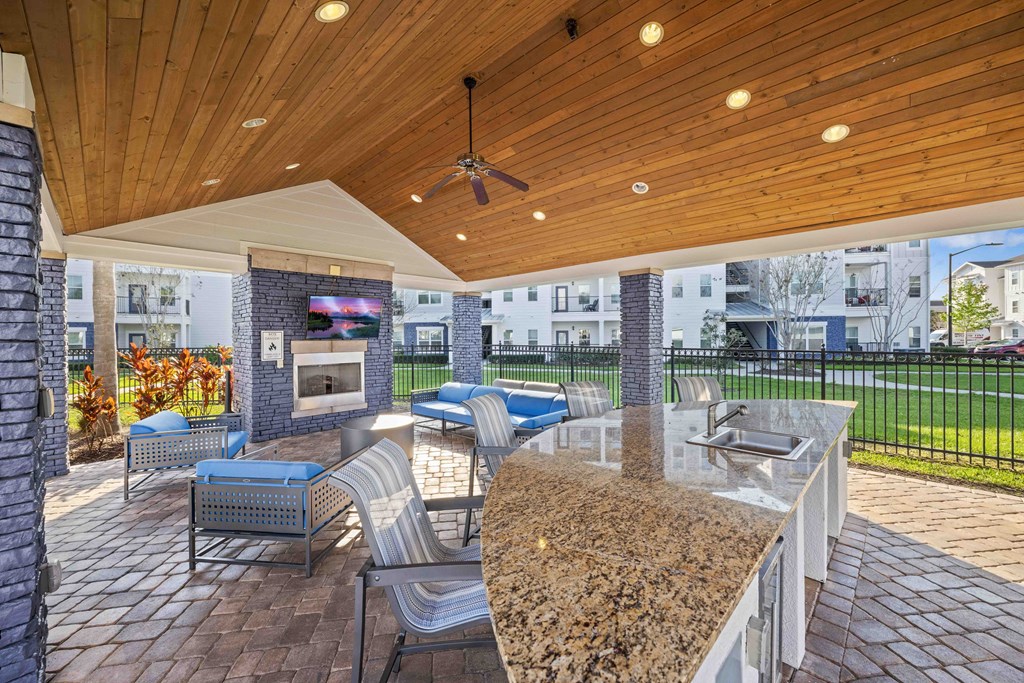 the estates at tanglewood|covered outdoor patio with fireplace