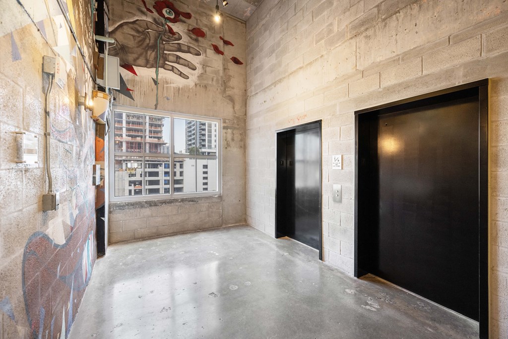 a mural of a hand hangs on the wall