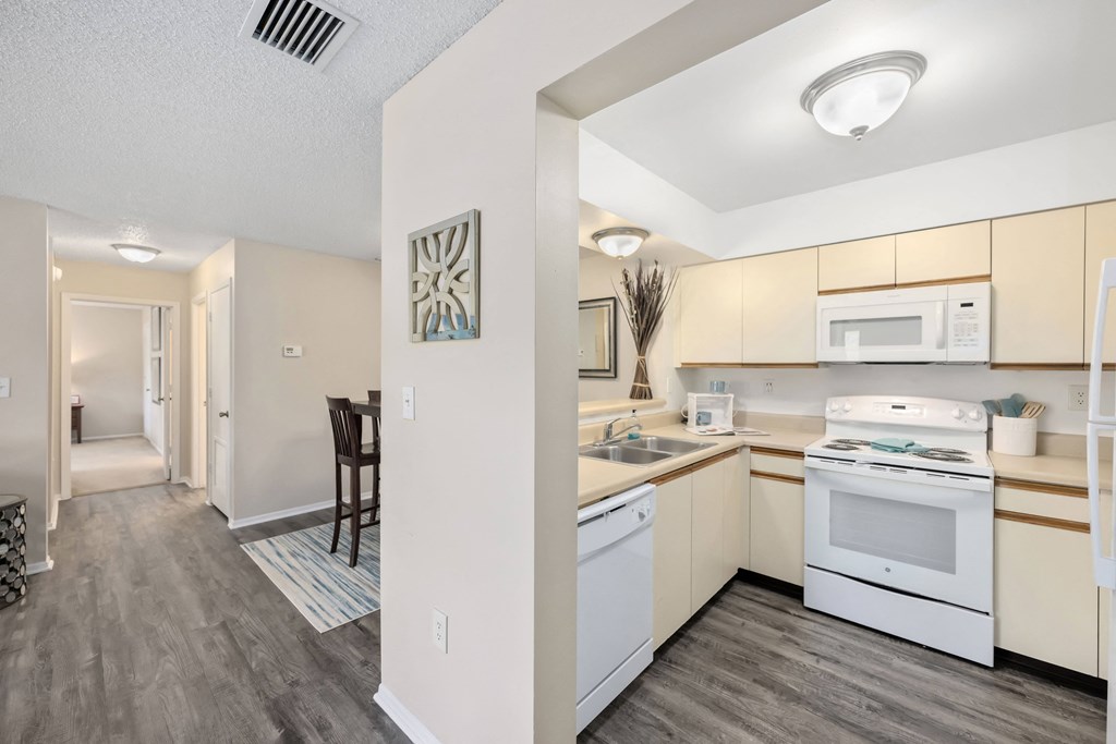 a kitchen and dining area in a 555 waverly unit