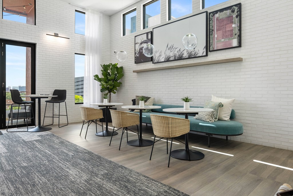 a living room with tables and chairs and a couch