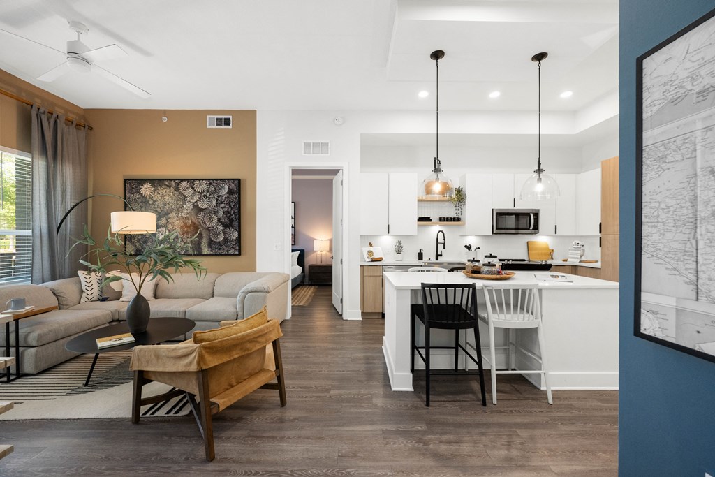 a living room with a kitchen and a dining room