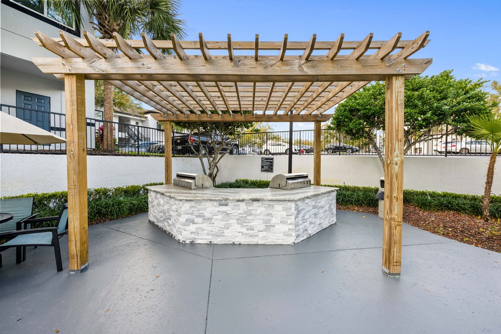 a patio with a seating area and a pergola